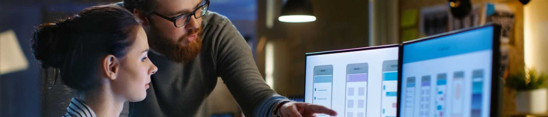 man and woman discussing a screen design and ux flow as background image for digital customer experience